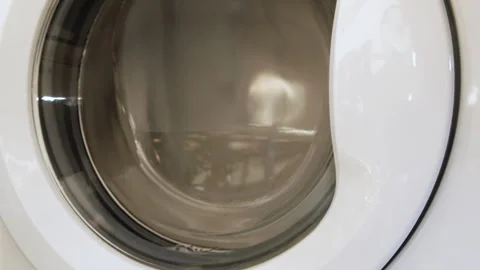 Very fast rotation of the washing machine and pressing of bed linen. Stock Footage 240956628