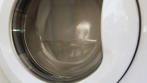 Very fast rotation of the washing machine. House cleaning. Stock Footage 243038615