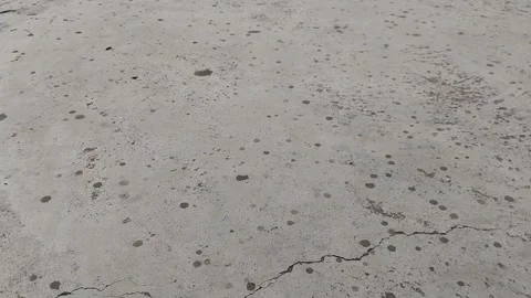 The very first drops of rain on the roof or concrete.  Stock Footage 253175797