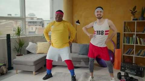 Very funny multi-ethnic men performing comical cardio dance workout exercise Stock Footage 133073084