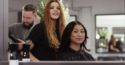 A very happy customer after having her hair done at a salon. Shot on RED Epic. Stock Footage 59737562