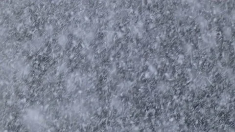 Very heavy snowfall during a blizzard in windy winter weather close-up Stock Footage 189370036