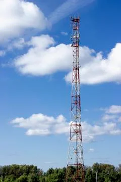 Very high cell tower on a background of blue sky Stock Photos