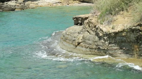 Very high cliff on the sea with waves Stock-Footage 64334164