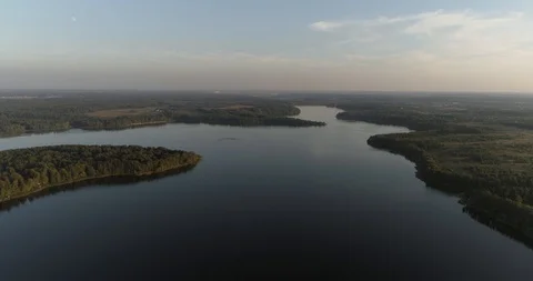 Very high flight over river and forest. Smooth forward motion. Video stock 94928052