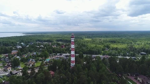 Very high lighthouse in white and red colors standing on the Ladoga coast. Stock Footage 100689840