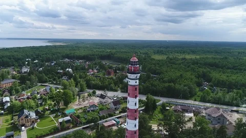 Very high lighthouse in white and red colors standing on the Ladoga coast. Stock Footage 100689961