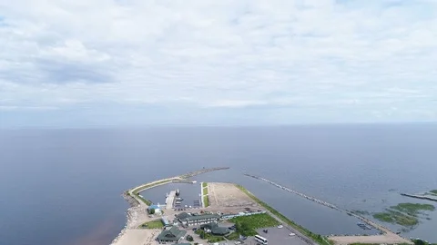 Very high lighthouse in white and red colors standing on the Ladoga coast. Stock Footage 100689981