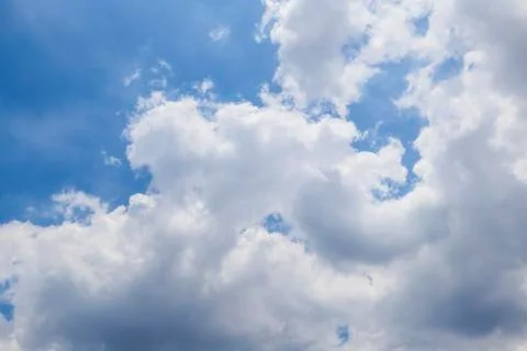 A very large cloud floating in a clear blue sky Stock Photos