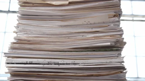 A very large stack of papers. Deadline, office overload, bureaucracy, paperwork Stock Footage 241770519
