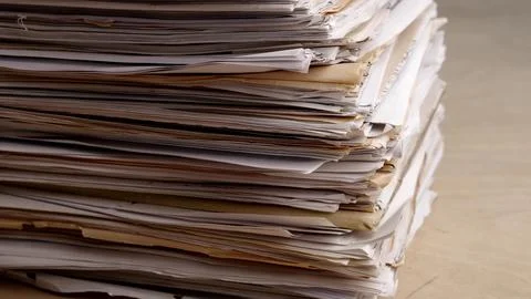 A very large stack of papers. Deadline, office overload, bureaucracy, paperwork Stock Photos