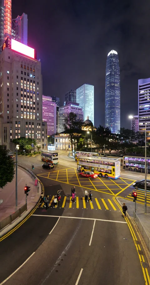 Very light night traffic at Central, Hong Kong, people walk at crossing Stock Footage 309402338