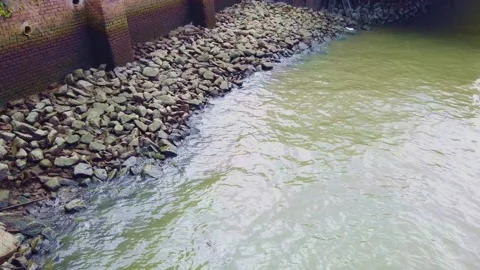 Very Light Waves Splasing On A Bed Of Rocks Stock Footage 231715252