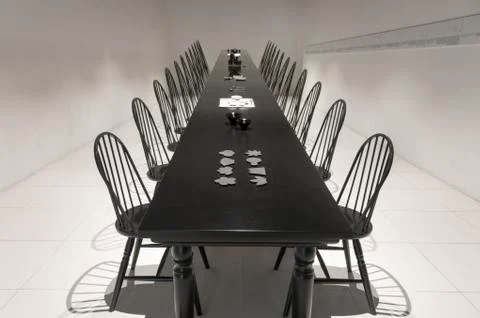 Very long black dining table Stock Photos