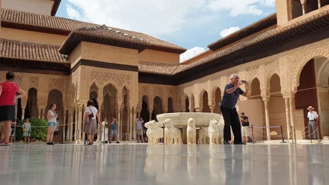 Very low angle view of tourists at lions court, alhambra, spain Stock Footage 280852144