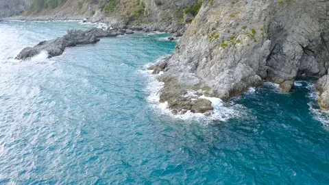 Very low flight trought sea rocks Stock Footage 121474783