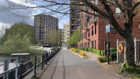 Very modern housing development in the UK - flats - gimbal shot Video stock 332173754