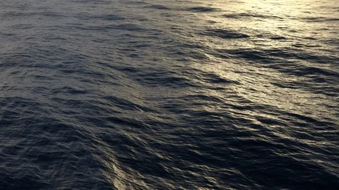 Very nice flying over ultra high detailed ocean surface with sunset Stock Footage 99341663