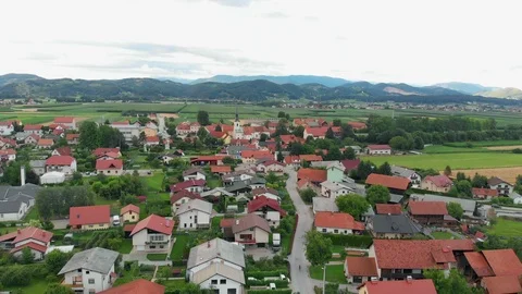 Very nice green fields behind a village Stock Footage 94699540