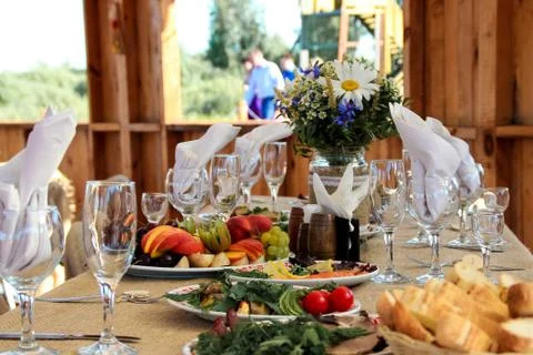 Very nicely decorated wedding table with plates and serviettes. Stock Photos