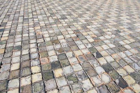 Very old and aged square tiles on the floor Stock Photos