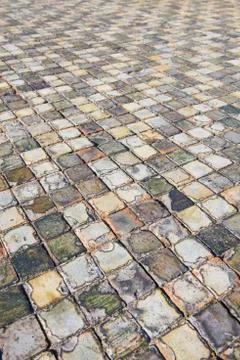 Very old and aged square tiles on the floor Foto stock