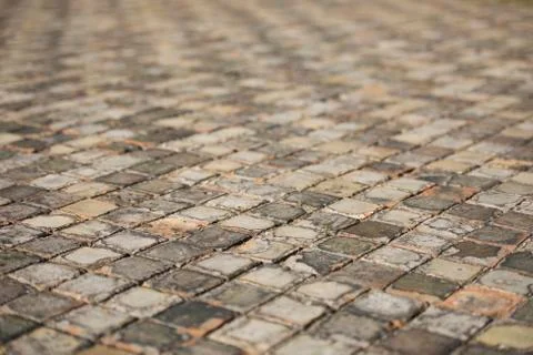 Very old and aged square tiles on the floor Stock Photos