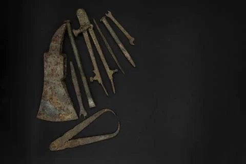 Very Old and Rusty Tools on Black Background with Free Space Stock Photos