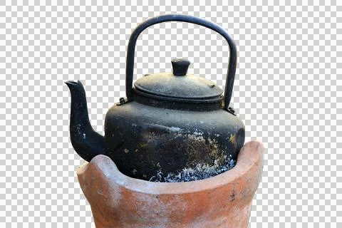 Very old black antique kettle on a small brown furnace isolated on white back Stock Photos
