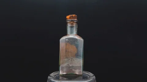 A very old can of mercury revolves on a black background Stock Footage 117539673