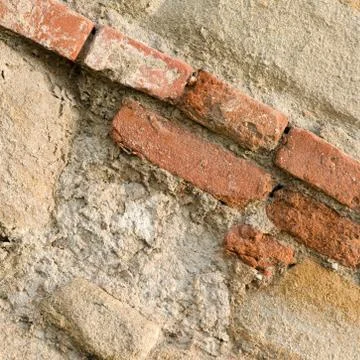 Very old downfallen brick wall of ancient building. Stock Photos