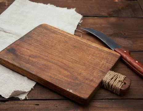 Very old empty wooden rectangular cutting board and knife, top view, very ... Stock Photos
