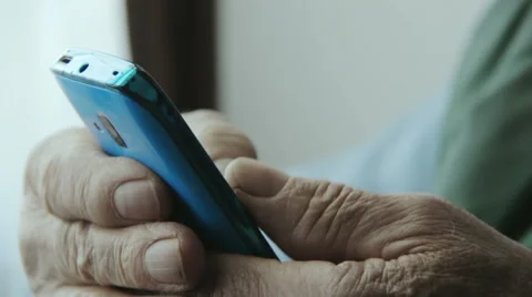 Very old man using mobile phone  Stock-Footage 48058647