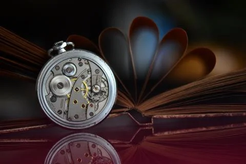 Very old pocket watch and book Stock Photos