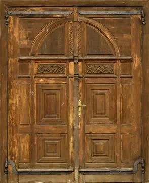 Very old solid wooden door in retro 19th century design close up Stock Photos