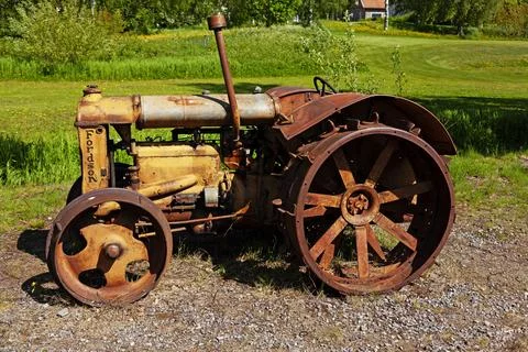 A very old tractor from the side Stock Photos