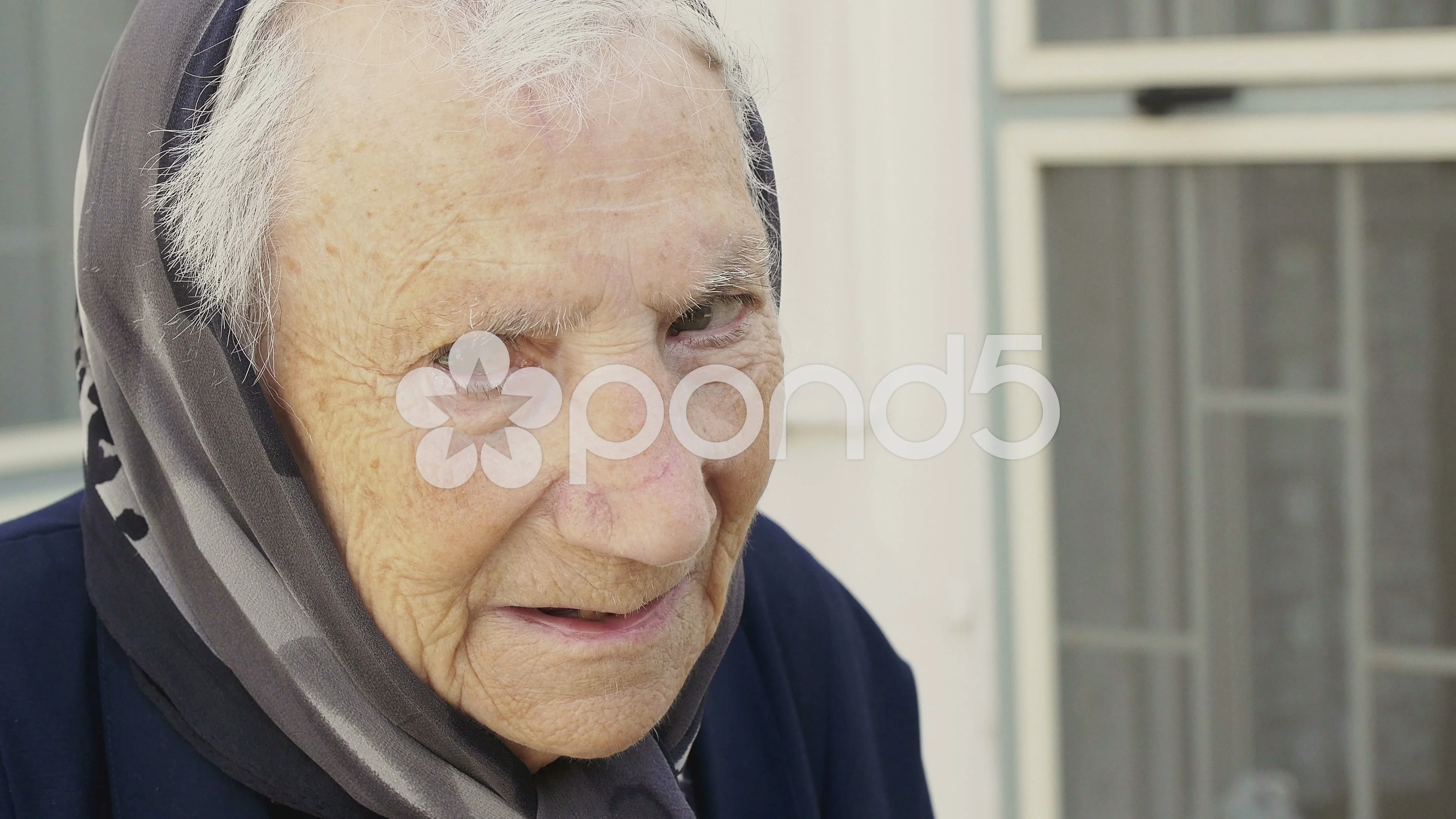 very old woman with a head scarf: italian old woman