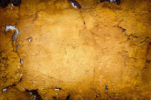 Very old yellow wall with cracks. Suitable for background Stock Photos