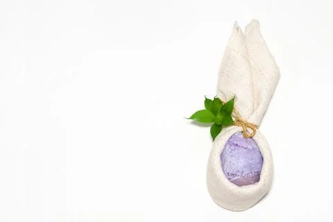 A Very Peri-colored egg with hare ears from a table towel Stock Photos