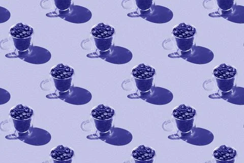 Very peri pattern: glass cups with coffee beans with hard shadow. Stock Photos