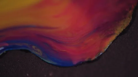 Very pretty mixture of blue, red and yellow watercolour in a flowing motion Video stock 101682119