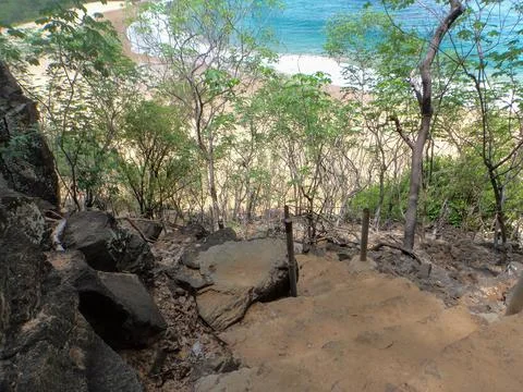 Very rustic path to the beach and a dangerous staircase Fotos de archivo