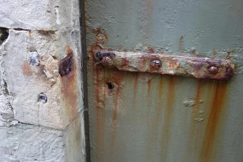 Very rusty old door interlock . long brown rust corrosion . red grate of iron . 스톡 사진