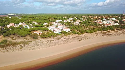Very slow backward aerial view of an urbanization of houses with swimming poo Stock Footage 147679802