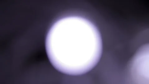 Very slow motion of flashing light on black background Vídeos de archivo 317478324
