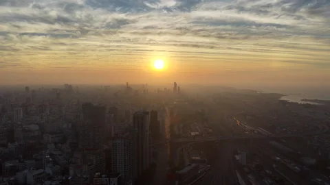 Very slow sunrise drone pan over Buenos Aires skyline and Río de la Plata Stock Footage 323871121
