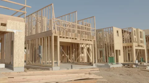 Very Slow Tilt on Framing Work on New Home Construction - Shallow Depth of F Stock Footage 139663345