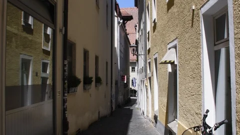 A very small and narrow lonely street in the historic center of Regensburg Stock Footage 120520122
