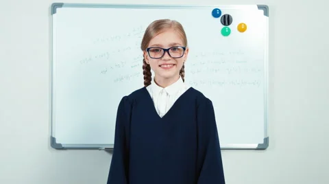 Very smart nerd with glasses smiling at the camera Stock Footage 64878149