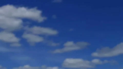 Very soft focus distinct puffy white clouds in deep blue sky Vídeos de archivo 153779641